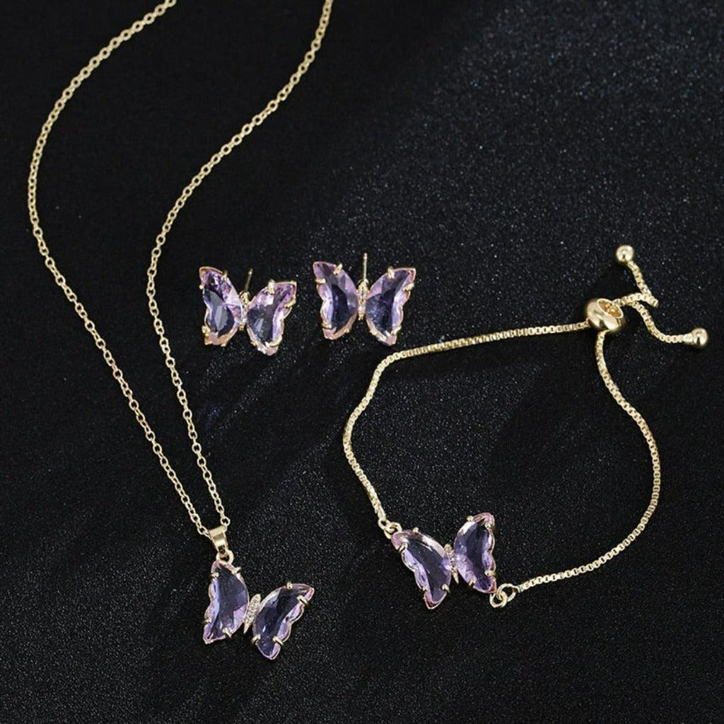 KIT Colar Pulseira e Brincos 3 Peças Jóias Romântica Borboleta de Vidro Varias Cores. 0 lojaidealgolden conjunto roxo claro 